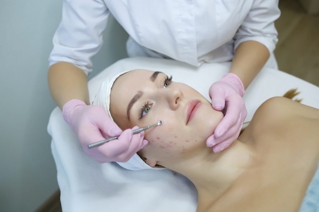 Cosmetologist does mechanical cleaning of the face. Women's cosmetology in the beauty salon